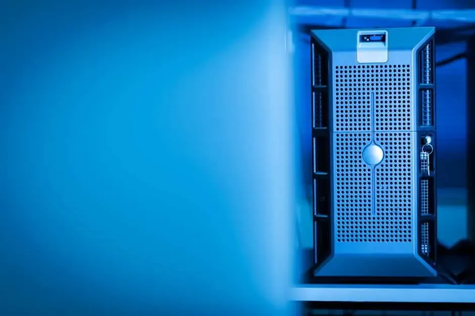 Single tower server with a perforated front panel in blue-tinted light