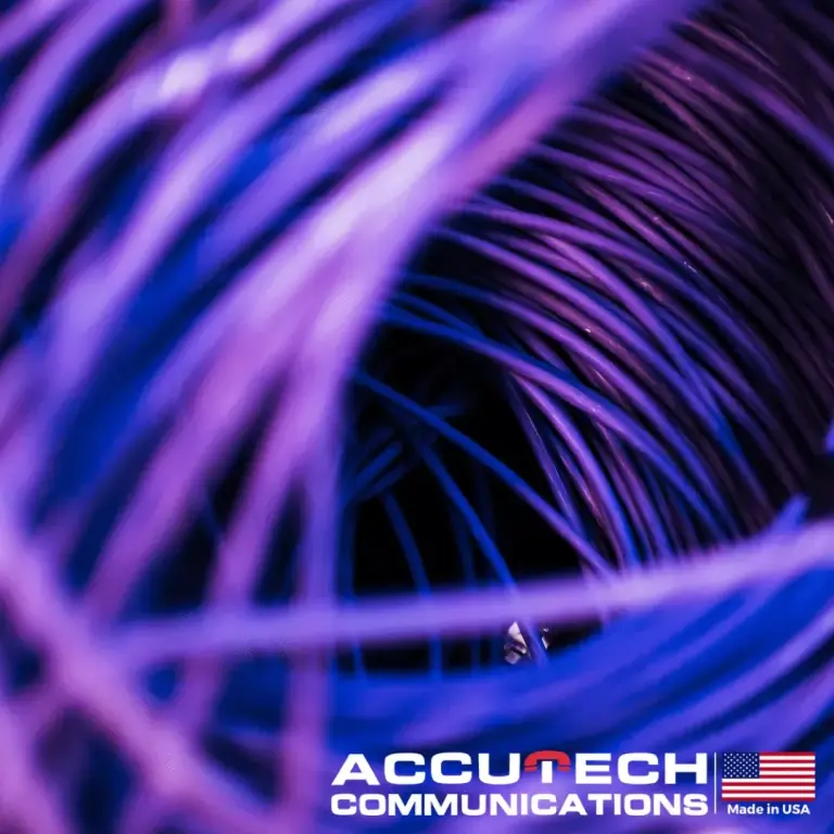 Purple-lit tangle of coiled cables viewed close up