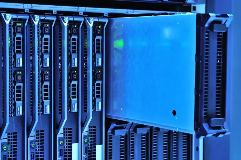 Blade server chassis with one blade pulled partway out under blue light